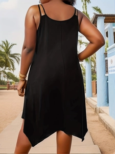 Back view of a black loose-fitting maxi dress with spaghetti straps and irregular hem