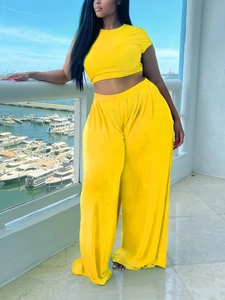 Bright yellow two-piece set with slim short sleeve top and high waist wide leg pants