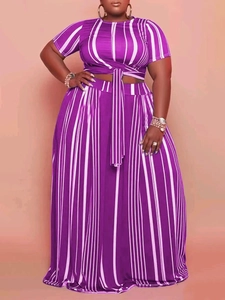 Plus size two-piece set featuring purple vertical stripe tie-front top and wide-leg pants