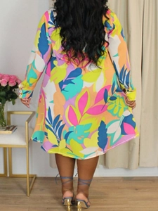 Women's plus size shirt dress with vibrant tropical leaf print and buttoned long sleeves