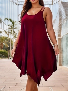 Detail of burgundy sleeveless satin dress featuring thin straps and asymmetrical hem