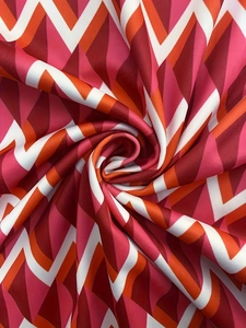 Detail of multi-color geometric zigzag fabric texture with high-density mesh weave