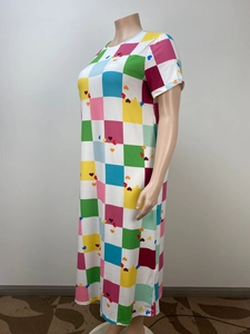 Detail view of colorful checkerboard print and small hearts on loose casual maxi dress