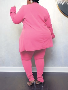 Rear view of vibrant magenta plus size two-piece set with long tunic and fitted pants