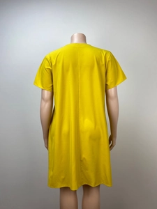 Rear view detail of a loose bright yellow plus size dress with short sleeves