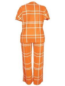 Rear view of casual two-piece set featuring orange checkered V-neck top and long pants