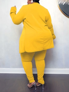Rear view of yellow V-neck two-piece set showing slim fit design and knit fabric texture