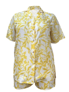 Detail of leaf print two-piece set featuring short sleeve button shirt and shorts