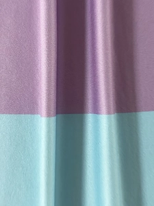 Detailed view of purple and light blue striped fabric with fine horizontal texture