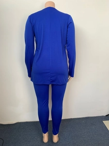 Back view of a dark blue women's two-piece casual suit featuring a V-neck top and slim pants