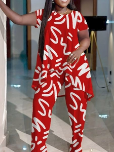 Close-up of red two-piece set with white abstract lines and asymmetrical hem design