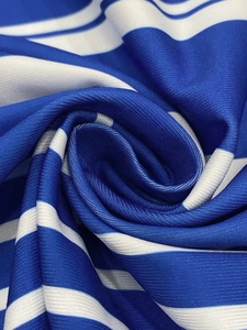 Macro view of blue and white striped knit fabric with breathable mesh texture details