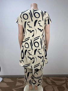 Detail view of the back side of a casual two-piece set with abstract black line prints