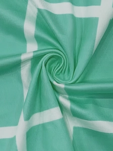 Close-up of mint green and white checkered fabric with elegant pleated texture detail