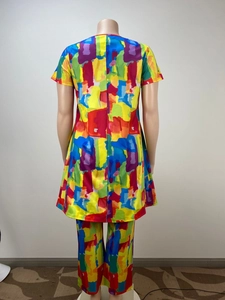 Close-up of vibrant abstract print on women's two-piece casual set with short sleeves