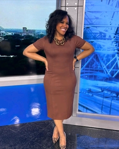 Detail view of a brown short-sleeve midi dress featuring a slim fit and classic crew neck