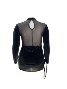Detail view of the velvet mini dress featuring sheer mesh back and teardrop cutout design