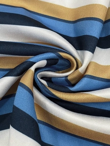 Macro shot of colorful horizontal stripes on fabric showing smooth texture and drape