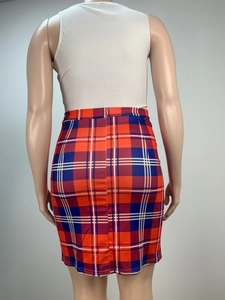 Detail view of red and blue tartan pencil skirt with a concealed back zipper closure