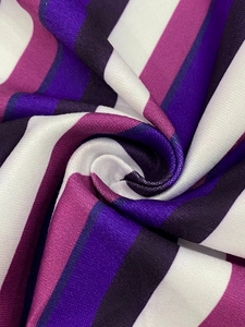 Detailed macro view of colorful striped fabric with a soft texture and elegant drape