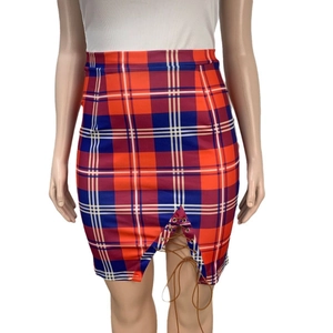 Detail of high waist plaid skirt featuring red and blue patterns and a lace-up slit design