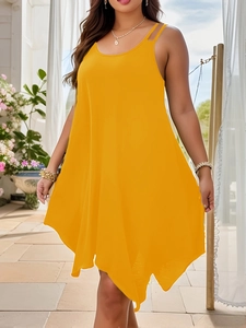 Detail of the bright yellow sleeveless dress with an irregular hem and flowing fabric
