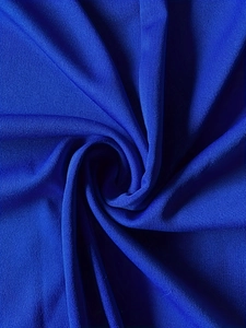 Detailed macro view of the dark blue high-elastic synthetic fabric with fine texture