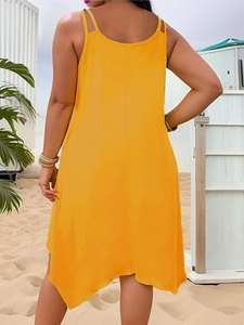 Detail view of the deep scoop back and double thin straps on the orange summer dress