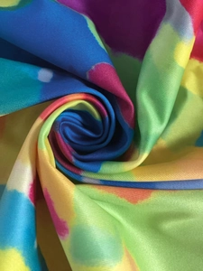 Detail of colorful tie-dye fabric showing soft texture and high-quality artistic prints