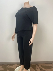 Side view of comfortable black loose-fit two-piece set with soft matte fabric finish