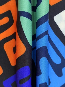Macro view of geometric abstract print on high-density textured dress fabric detail
