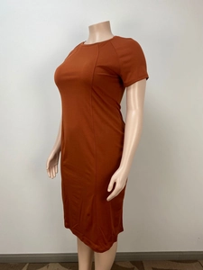 Detail view of the caramel-colored short sleeve fitted dress for women on a plus-size mannequin