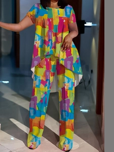 Women's casual two-piece set with vibrant abstract print featuring high-low top and wide-leg pants
