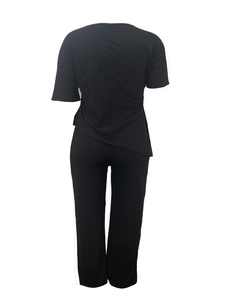 Women's black casual two-piece set with asymmetrical hem top and wide-leg trousers