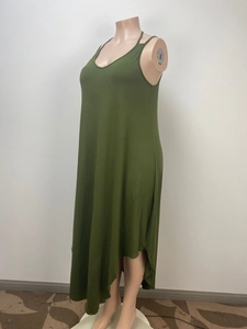 Detail of olive green sleeveless V-neck maxi dress with asymmetric hem on mannequin