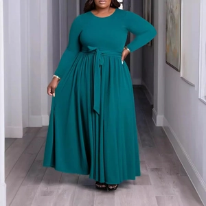Detail view of dark green plus size maxi dress featuring long sleeves and a waist belt