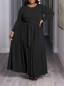 Elegant long sleeve black maxi dress with a high waist and matching waist belt