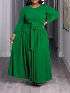 Elegant long-sleeved plus size maxi dress in bright green with high waist belt and wide skirt
