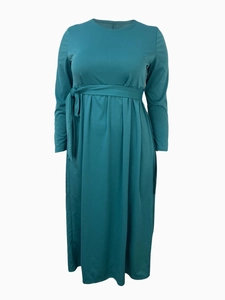 Close-up of the waist tie and soft pleated fabric on a dark teal maxi dress