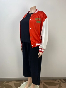 Side view detail of red and white baseball jacket with 'MOME 1998' logo print