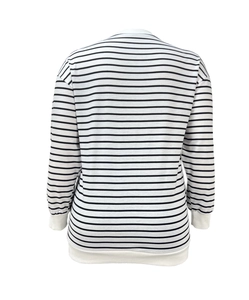 Macro detail of the white ribbed cuffs and black horizontal stripes on casual sweatshirt