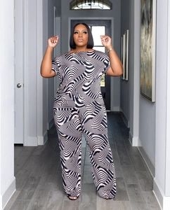 Detail of plus size two-piece set featuring black and white wave print on wide-leg pants