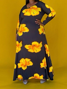 Elegant long sleeve maxi dress with vibrant yellow floral print on a sleek black fabric