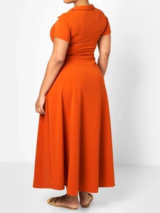 Back view of orange lapel maxi dress showing the flowing fit and premium fabric texture