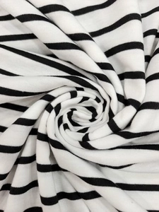 Macro detail of high-quality black and white striped knit fabric with soft texture