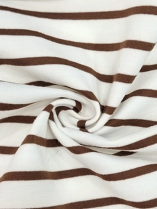 Macro detail of high-quality brown and white striped knit fabric showing soft texture