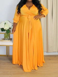 Elegant bright yellow V-neck maxi dress with wrap design and waist tie for a stylish look