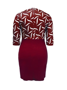 Detail view of the deep red back zipper and floral splice design of the bodycon dress