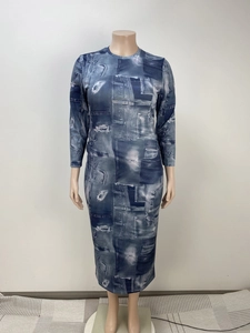 Detailed view of long sleeve midi dress featuring vintage denim patchwork print design