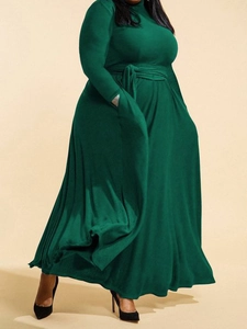 Elegant dark green plus size maxi dress with long sleeves and a belted waist tie